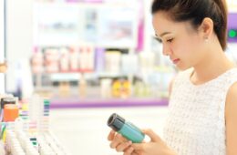 Woman shopping in the cosmetics' section of a store