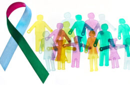 Multicolored ribbon and illustrations of differently colored people to represent the concept of rare diseases
