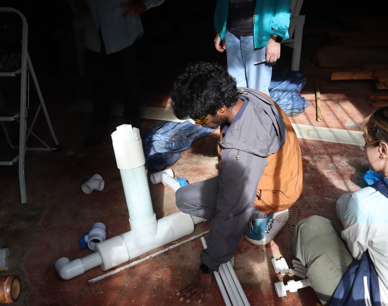 Members of the CWRU chapter of Engineers Without Borders building a water chlorinator and sediment filtration system