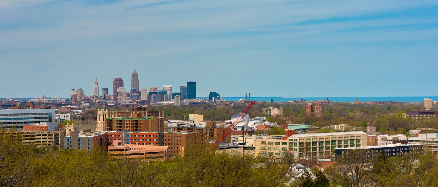 Aerial view of campus with background of downtown Cleveland