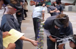 A group of students use the Microsoft HoloLens mixed-reality headset
