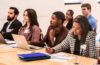 A group of participants listen and take notes at 2023 Morgenthaler-Pavey Startup Competition, captured by Character Studies Photography.