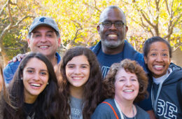 Photo of smiling legacy students and their families at CWRU.