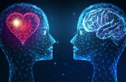 Futuristic emotional and intellectual intelligence concept with glowing low polygonal human heads with heart and brain isolated on dark blue background