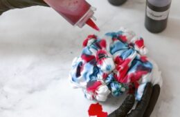 Woman's hands making tie dye clothes