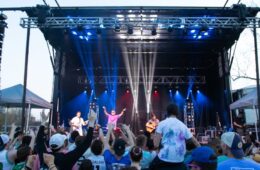 Crowd participates as a feautred artist performs onstage at Springfest concert.