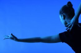 woman dancing on a blue background