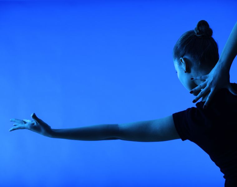 woman dancing on a blue background