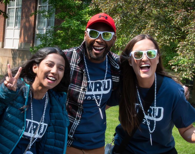 Three Case Western Reserve University students pose and smile for the camera