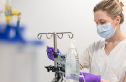 Photo of a CWRU nursing student preparing an IV bag