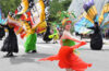 Photo of people dancing as butterflies during a Parade the Circle event