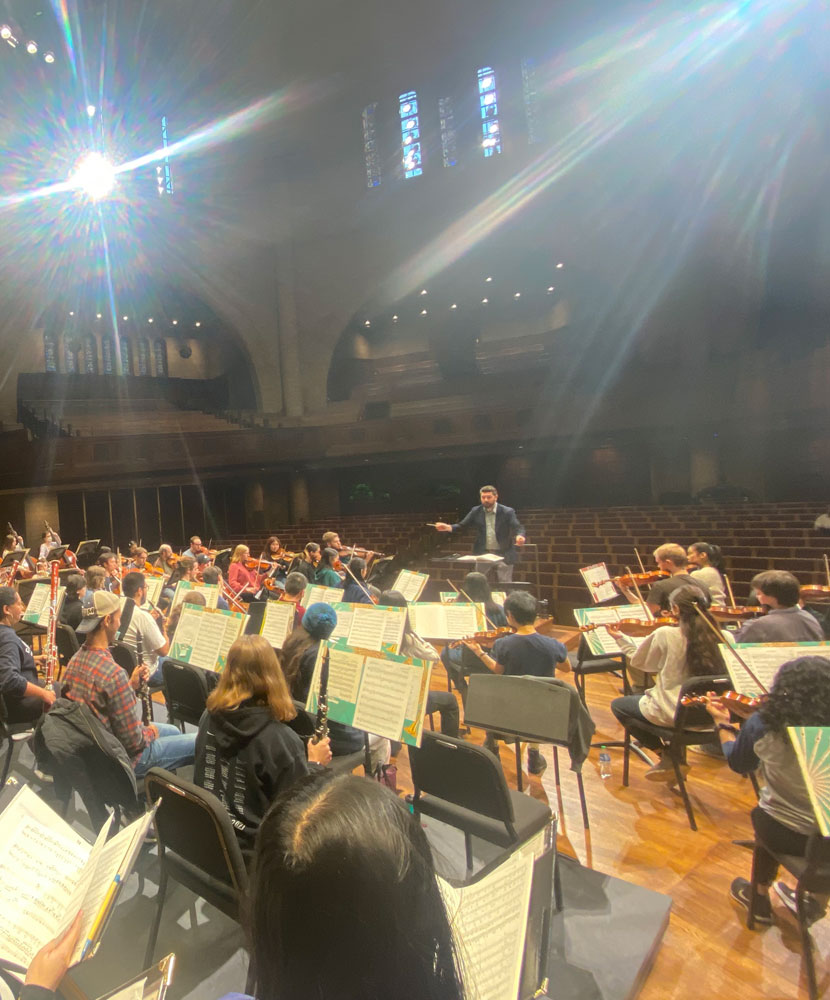 Photo of Christopher Clark directing the Case/University Circle Symphony Orchestra and the Case Concert Choir