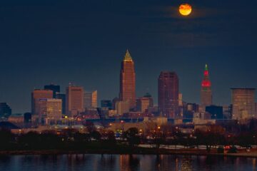 The December full moon high above downtown Cleveland, Ohio