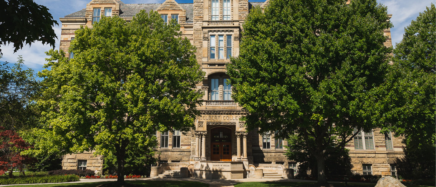 Photo of Adelbert Hall from the Case Quad side with trees in front of it