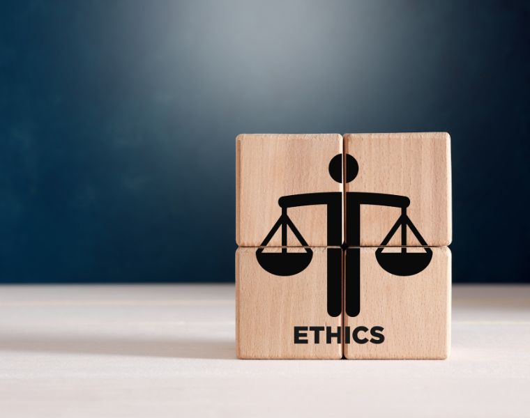 Business ethics or justice symbol on wooden cubes. Ethical corporate culture, business integrity and moral principles concept.