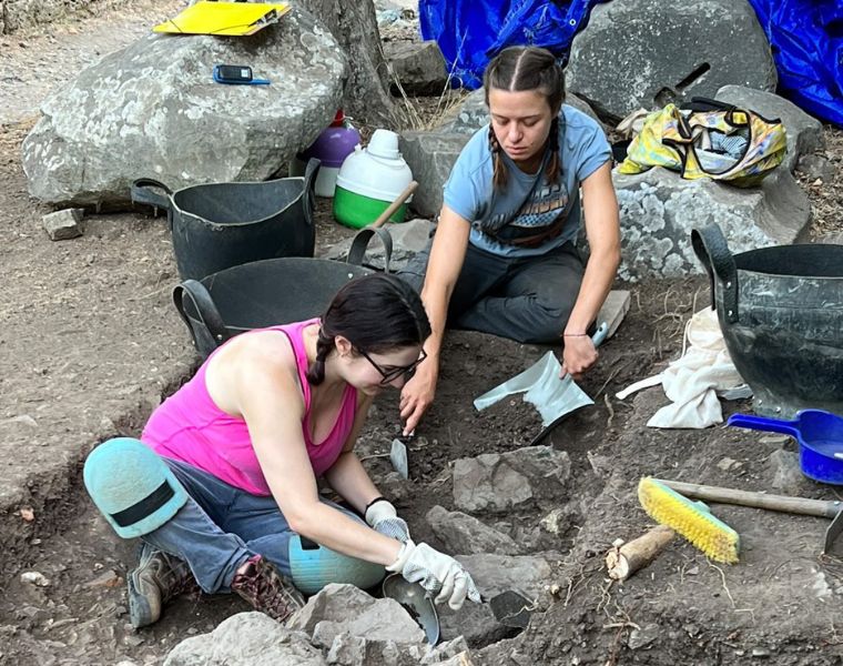 Photo of two CWRU students at an excavation site in Greece