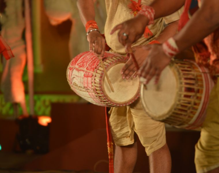 Artists perform with indian music instrument dhol in open stage