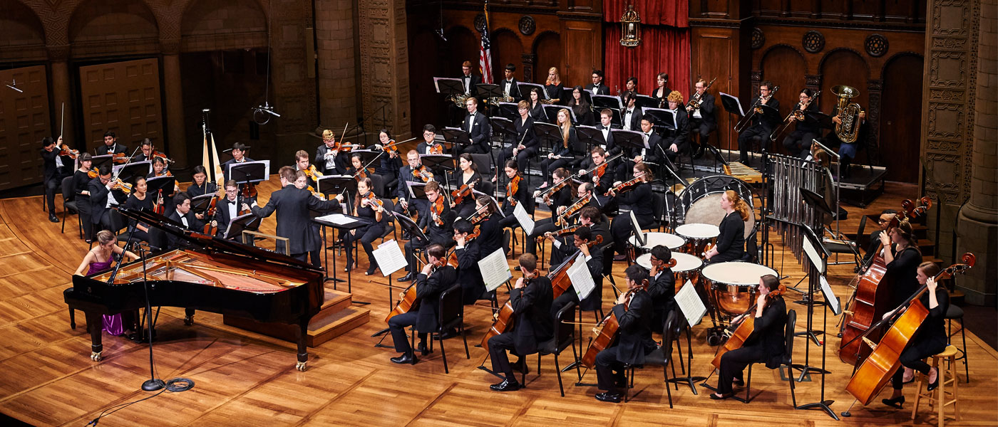 Photo of a CWRU orchestra performing on stage