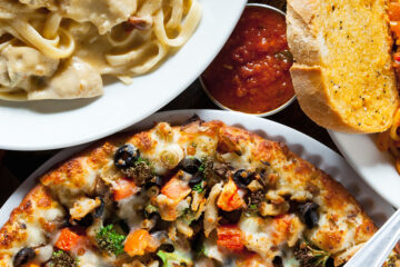 Close up of pizza, pasta and other carbs