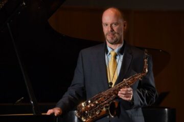 Photo of Greg Banaszak with his saxophone