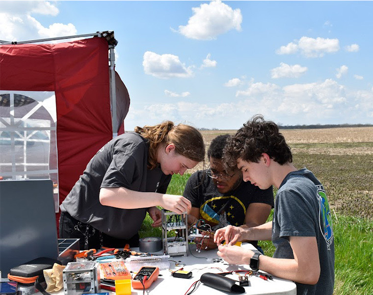 Photo of the Case Rocket Team working on a project