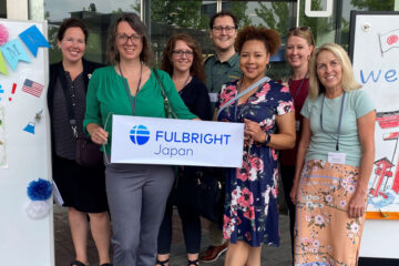 Photo of Cami Ross and her Fulbright program in Japan colleagues with welcome signs
