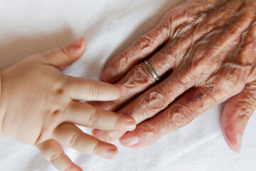 Photo of a grandparent and child's hands