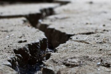 Close up of cracked road concrete. Courtesy of Getty Images.