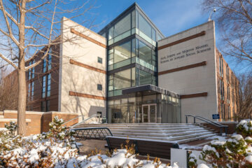 Photo of the exterior of the Jack, Joseph and Morton Mandel School of Applied Social Sciences during winter