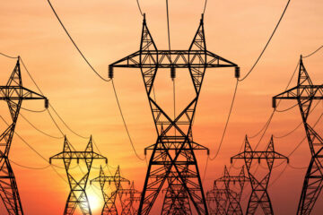 Photo of electric power lines at sunset