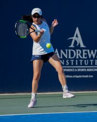 Photo of Hannah Kassaie hitting a ball during a tennis match. Courtesy of the United States Tennis Association.