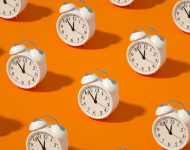 Alarm Clock on Orange Color Background