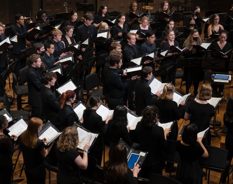 Side view of CWRU choir singing during homecoming in 2022.