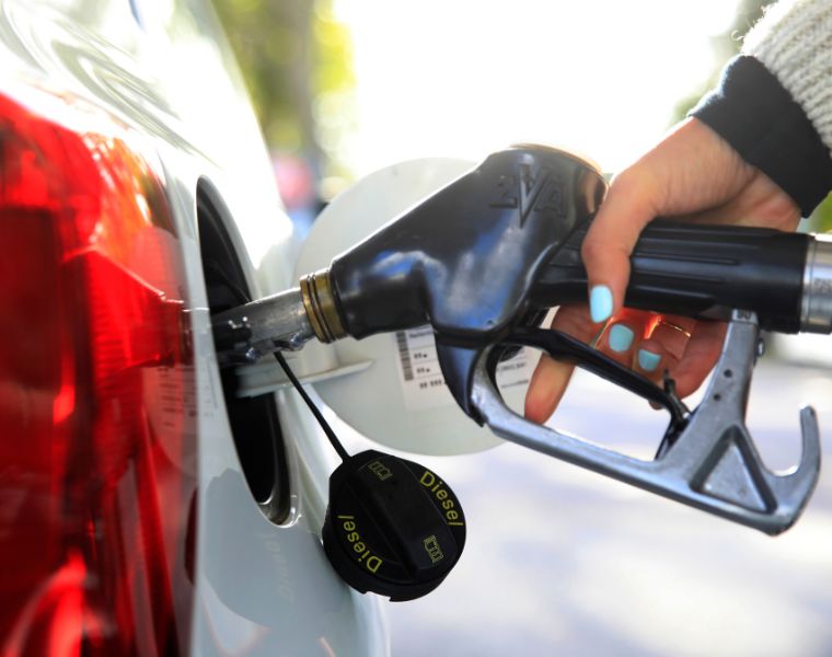 Close-up of a person refueling diesel at a petrol station. Courtesy of Getty Images.