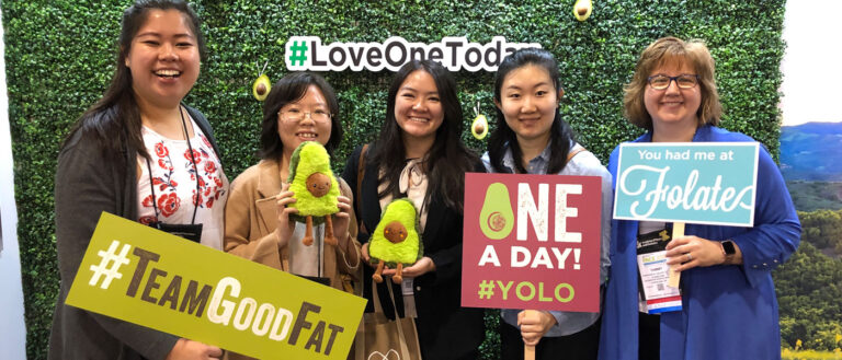 Tamara Randall and students pose for a photo opportunity featuring avocado memorabilia to promote healthy fats