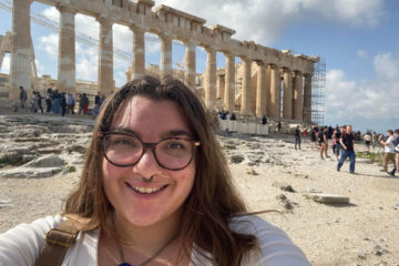 Silvana Corrales Cantelmi poses for a photo in front of the Parthenon