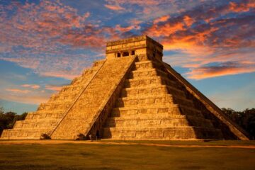 Photo of El Castillo (Kukulkan Temple) of Chichen Itza at sunset, Mexico. Courtesy of Getty Images.