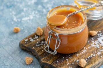 Glass jar with homemade salted caramel, courtesy of Getty Images.