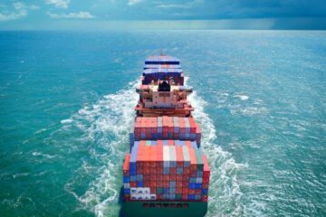Aerial view of freight ship with cargo containers, courtesy of Getty Images.