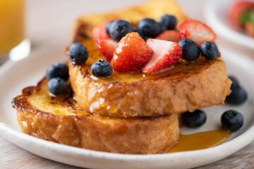 Close up view of french toast and berries