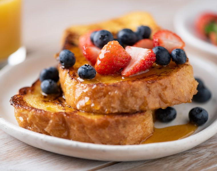 Close up view of french toast and berries