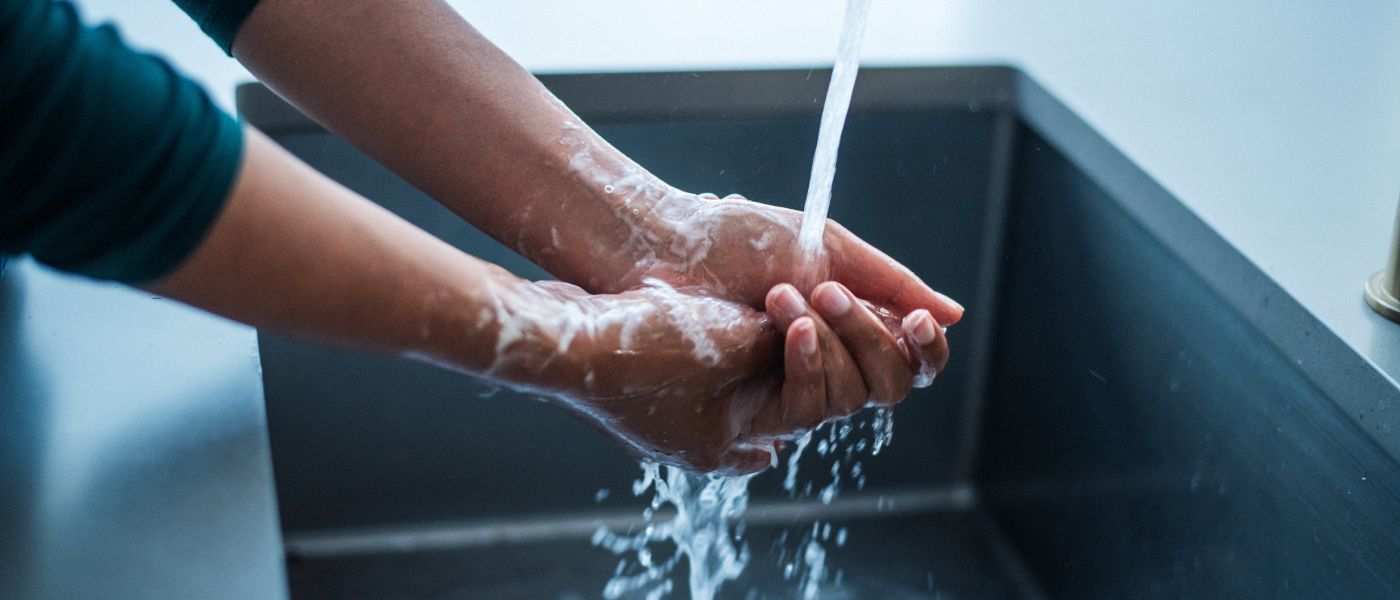 Close up of a woman washing her hands. Courtesy of Getty Images.