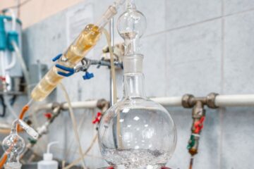 Process of alcohol distillation with glassware and heater, courtesy of Getty Images.