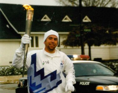 Photo of Jason Bradshaw carrying Olympic torch