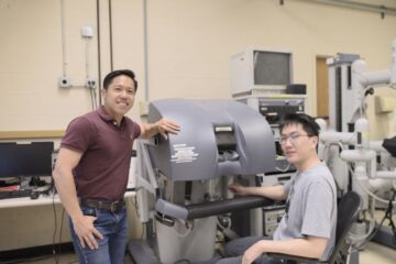 Zonghe Chua and his graduate student Yizhou Li at work to develop an autonomous coaching system for surgeons