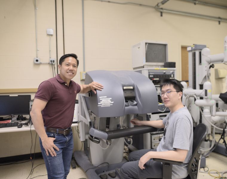 Zonghe Chua and his graduate student Yizhou Li at work to develop an autonomous coaching system for surgeons