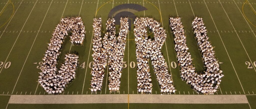 Students of the Class of 2028 spell out "CWRU"