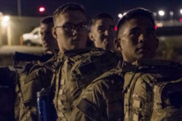 Photo of Brendan Silva lined up waiting to board the plane for deployment