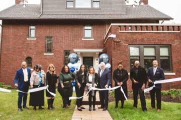 Photo of President Kaler and community leaders cut the ribbon on the opening of the Wade Park Community Center