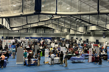 Photo of students meeting with employers during the Career Fair